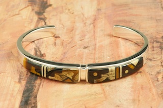 Stunning Bracelet featuring Genuine Picture Jasper and Black Jade inlaid in Sterling Silver. Heavy Gauge Sterling Silver Bracelet Designed by Navajo Artist Calvin Begay. Signed by the artist.